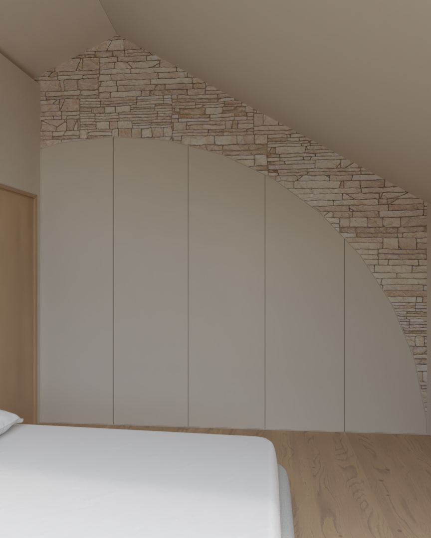Rénovation haut de gamme d'une maison dans l'Aveyron, à Cantobre avec mur en pierre et dressing dans le mur dans une chambre avec un lit visible en bas à gauche. Agencement sur mesures.