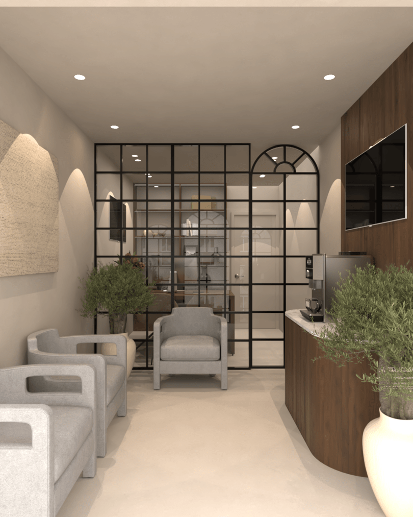 Rénovation haut de gamme d'un bureau au Maroc avec une table en bois, deux chaises en tissu beige, une chaise de bureau noire et blanche, canapés gris, plantes en pot, une machine à café, cloison en métal noir et télévision murale.