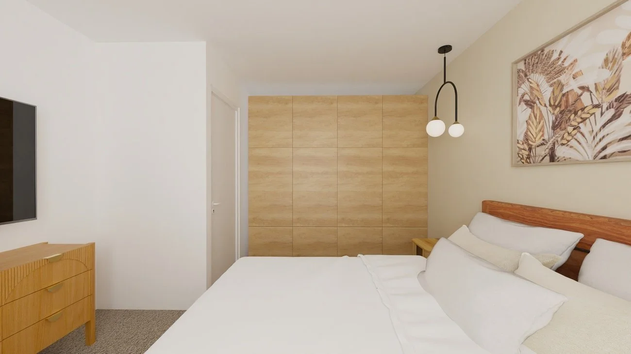 Rénovation haut de gamme d'un appartement à Valdahon avec chambre moderne avec lit, suspension à deux lampes, tableau de feuilles, mobilier en bois clair, murs blancs et sol en tapis beige. Agencement sur mesures.
