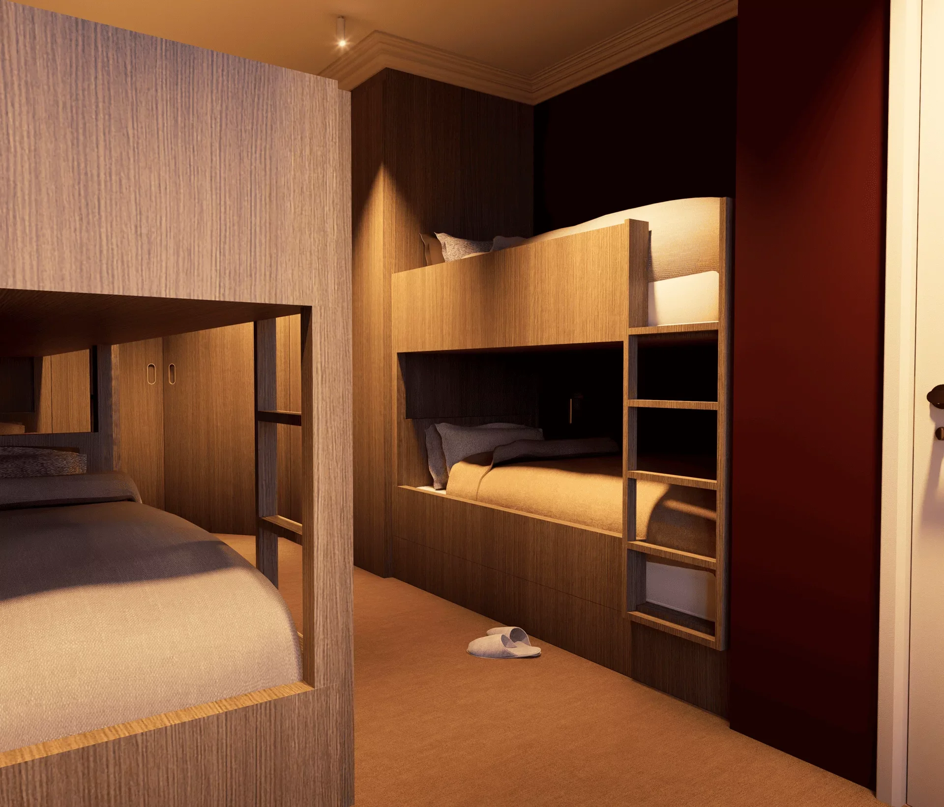 Chambre avec lit superposé en bois, une paire de chaussons près du lit, un mur rouge et une porte blanche.
