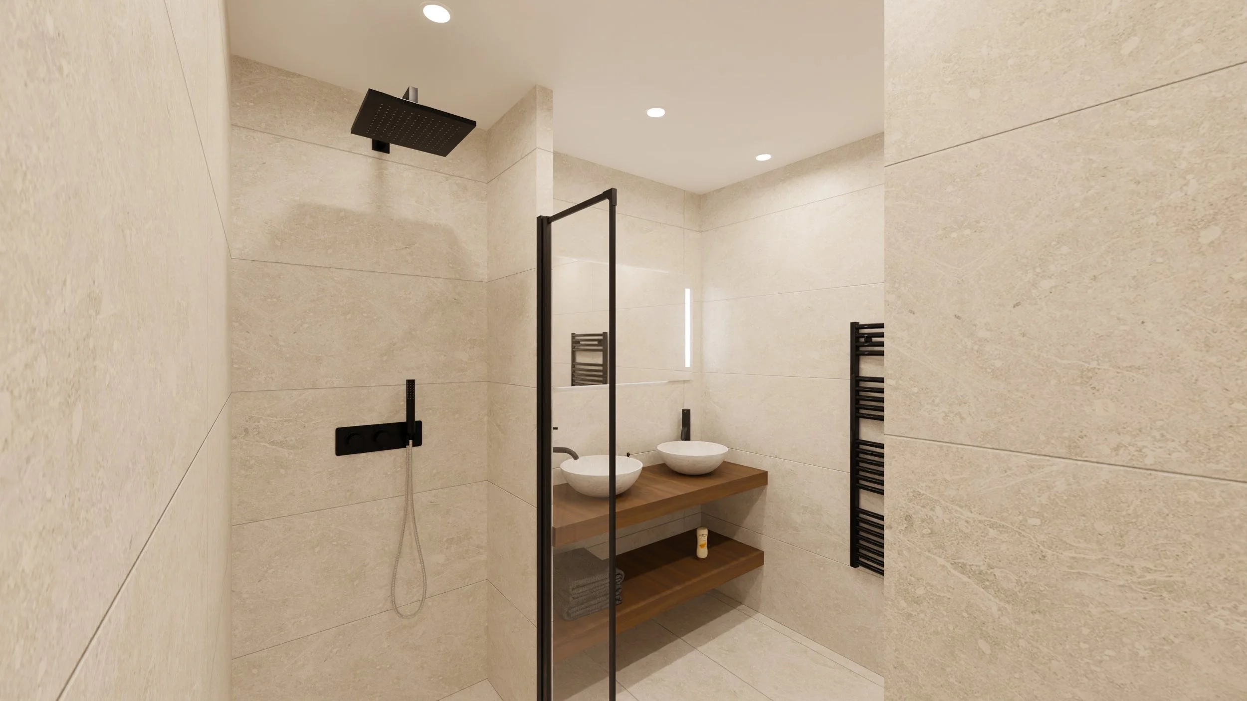 Rénovation haut de gamme d'un appartement avec salle de bain moderne avec des murs en pierre claire, une douche à l'italienne avec un plafond de douche noir, deux vasques rondes sur un meuble en bois, et un radiateur noir. Agencement sur mesures