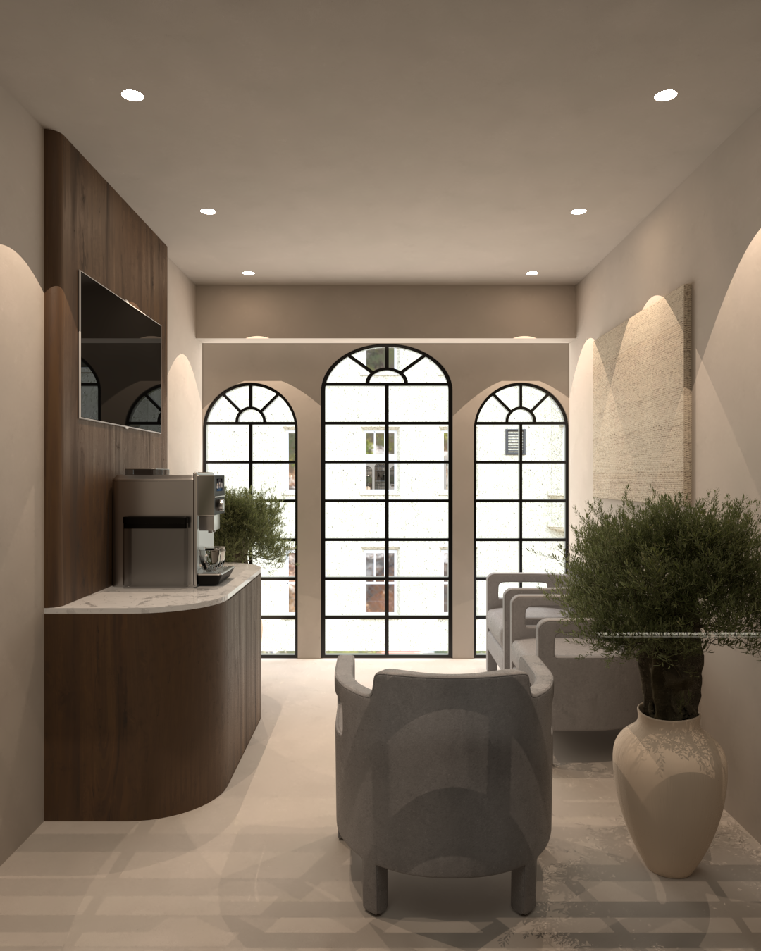 Rénovation haut de gamme d'un bureau au Maroc avec salon intérieur avec meuble central, fauteuils gris, grande fenêtre en arc, plantes vertes en pot, murs blancs, plafond avec spots lumineux. Tadelakt, agencement sur mesures.