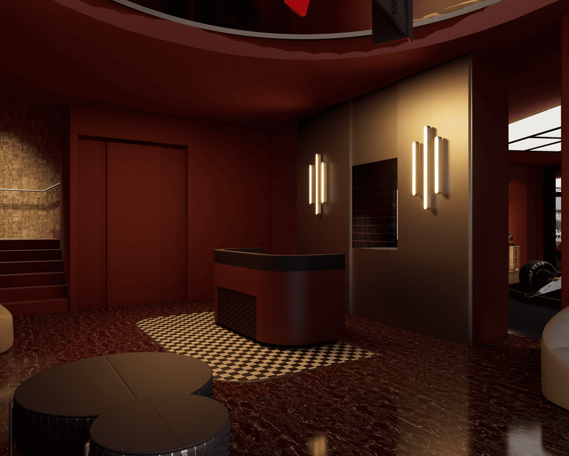 Intérieur d'un hall d'hôtel avec des murs rouge foncé, sol en marbre rouge, un fauteuil beige, des œuvres d'art encadrées sur le mur, un comptoir arrondi noir avec un mur en brique en arrière-plan, et un escalier menant à un étage supérieur.
