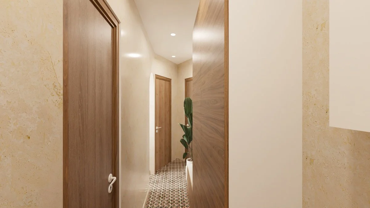 Rénovation haut de gamme d'un appartement dans Paris 12 avec entrée avec portes en bois, murs beige et sol en carrelage géométrique, plante verte dans un pot blanc. Agencement sur mesures