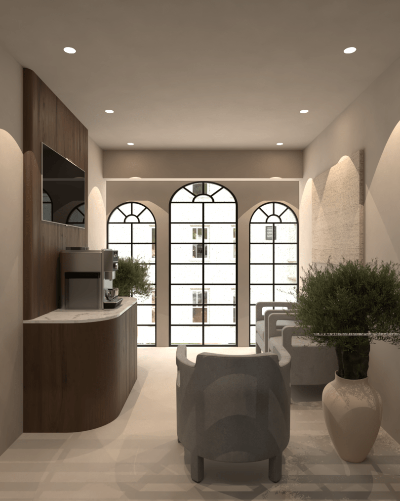 Rénovation haut de gamme d'un bureau au Maroc avec salon intérieur avec meuble central, fauteuils gris, grande fenêtre en arc, plantes vertes en pot, murs blancs, plafond avec spots lumineux. Tadelakt, agencement sur mesures.