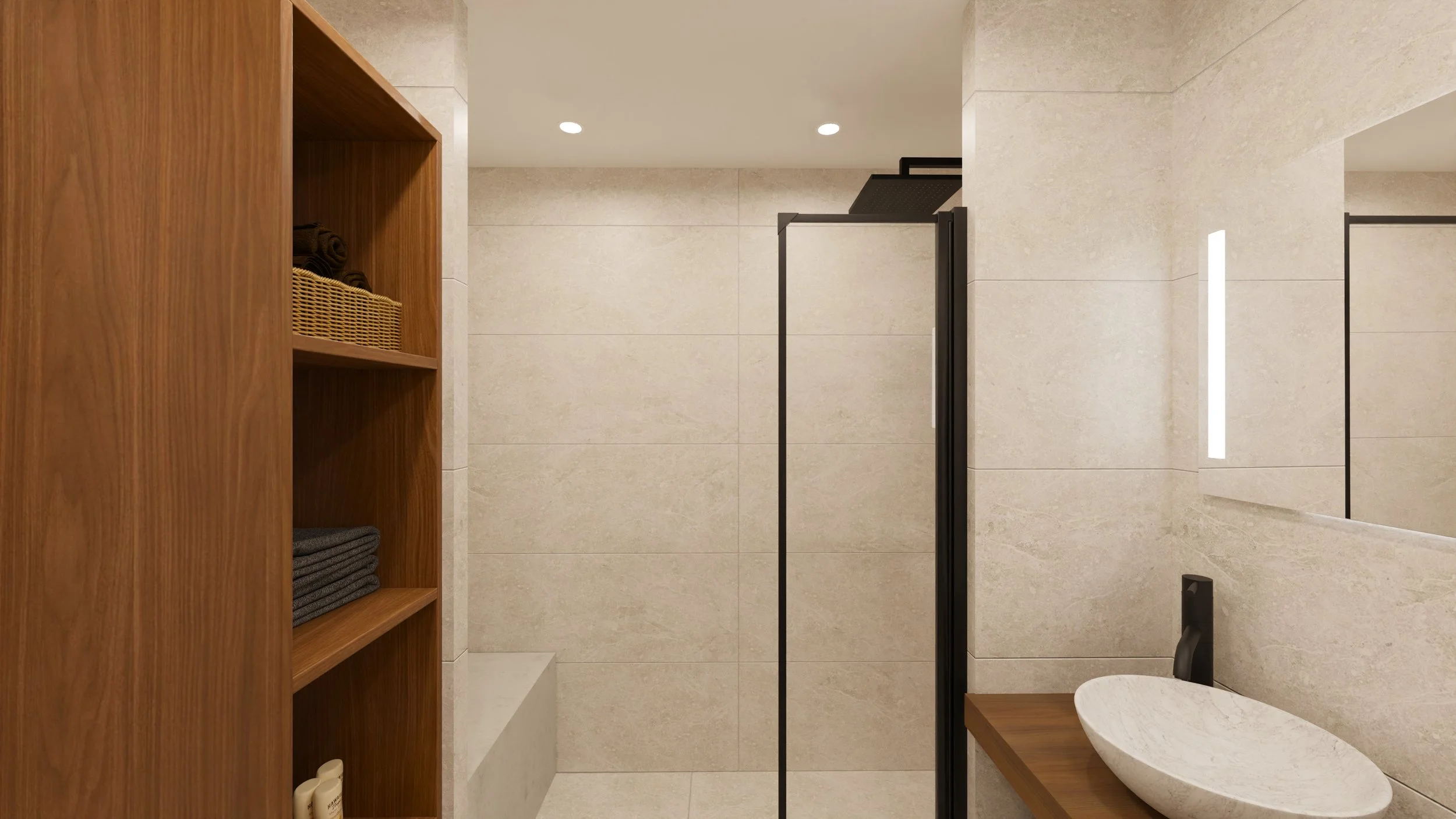 Rénovation haut de gamme d'un appartement avec salle de bain moderne avec des murs en pierre claire, une douche à l'italienne avec un plafond de douche noir, deux vasques rondes sur un meuble en bois, et un radiateur noir. Agencement sur mesures