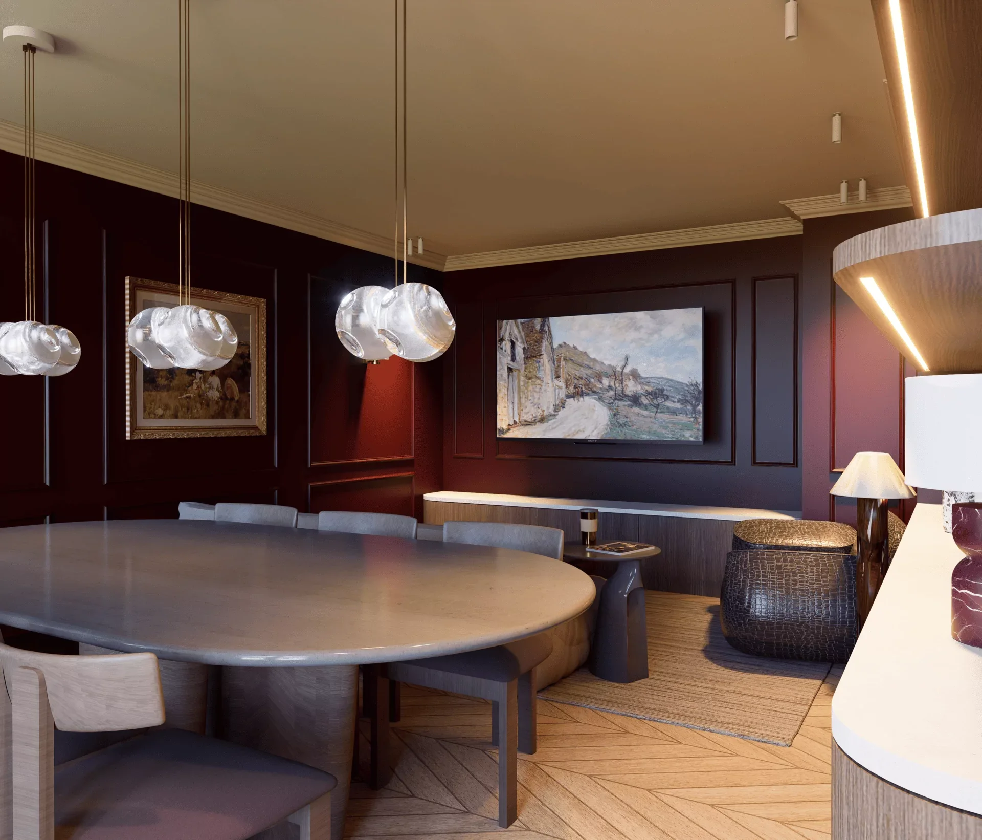 Intérieur d'une salle à manger avec un grand meuble ovale, des chaises en bois clair, des lampes suspendues en verre, un tableau représentant une scène de village, et un livre sur une table accompagnée d'une lampe.