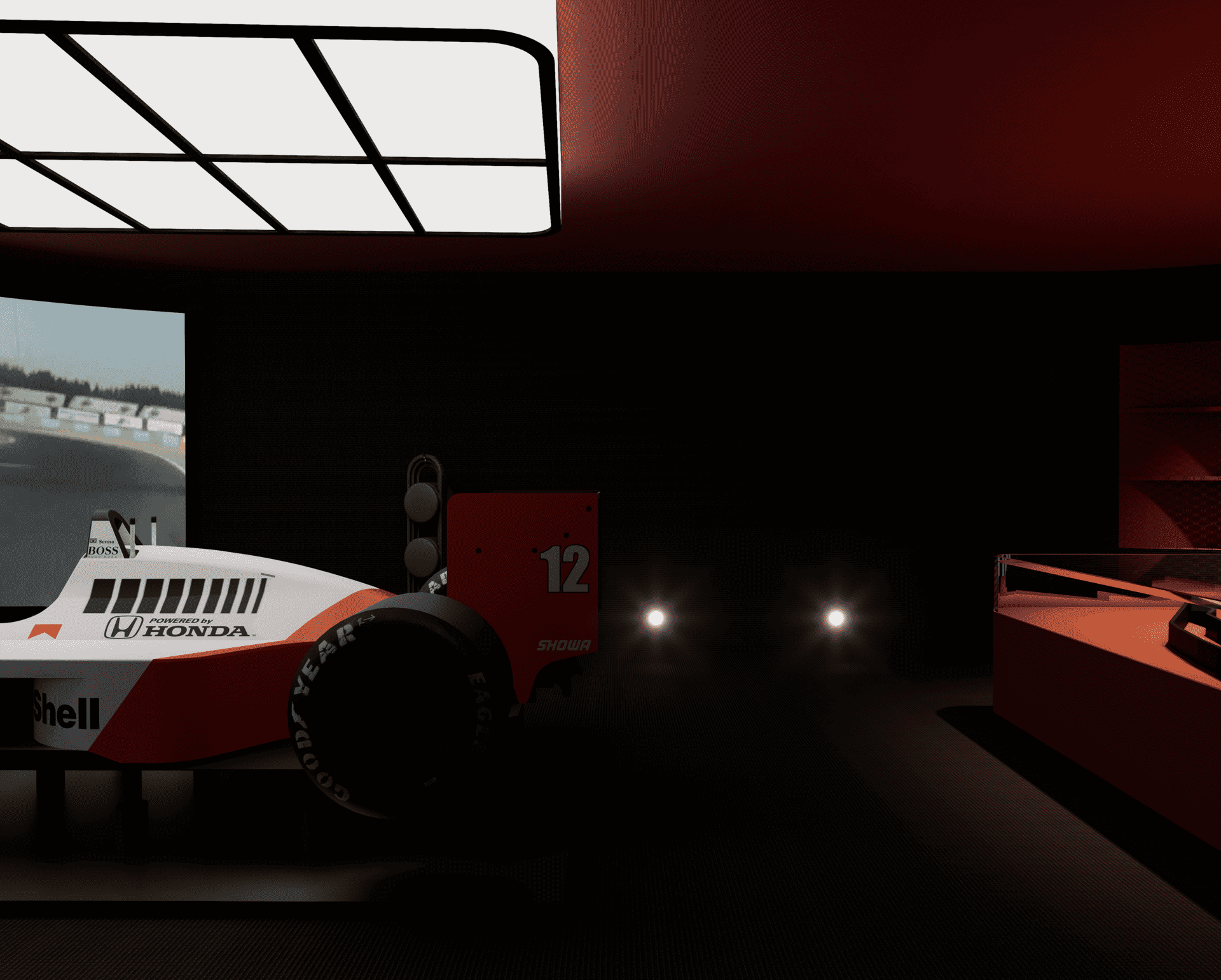 Voiture de course de Formule 1 en simulateur, dans une pièce sombre.