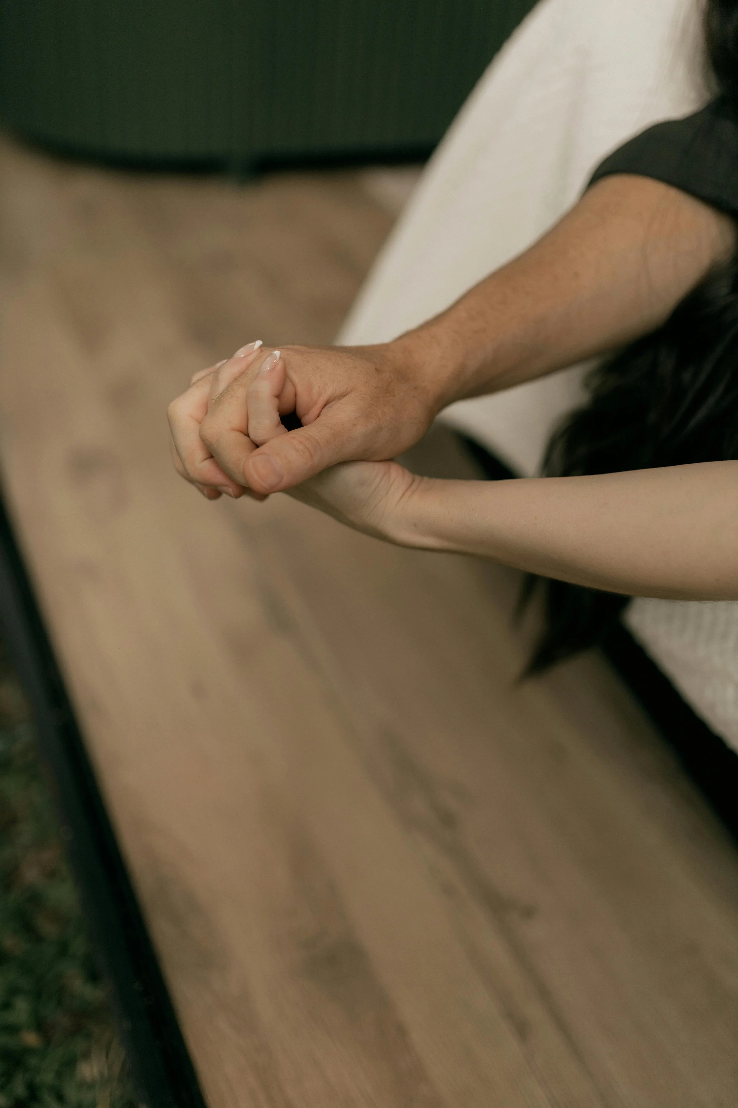 A close-up of two hands gently holding, representing a safe, non-judgmental space to discuss desire discrepancy, sexual trauma, and relationship intimacy at Made Whole Counseling.