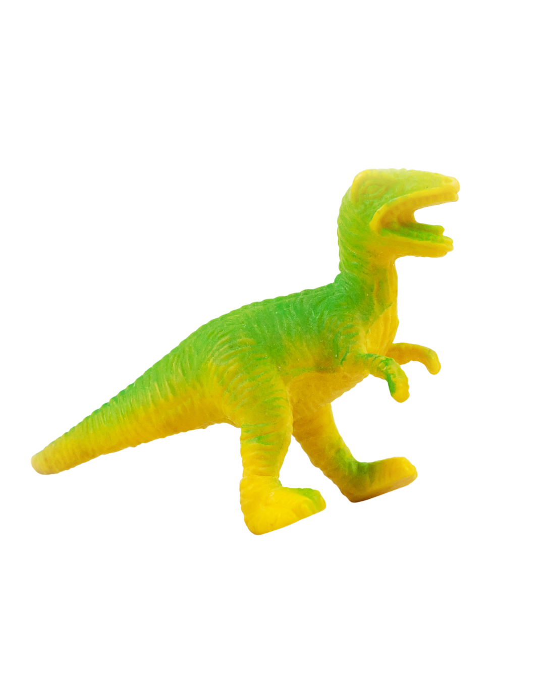 Colorful rubber toy in the shape of a dinosaur, primarily yellow and green, with a partly open mouth and small arms.