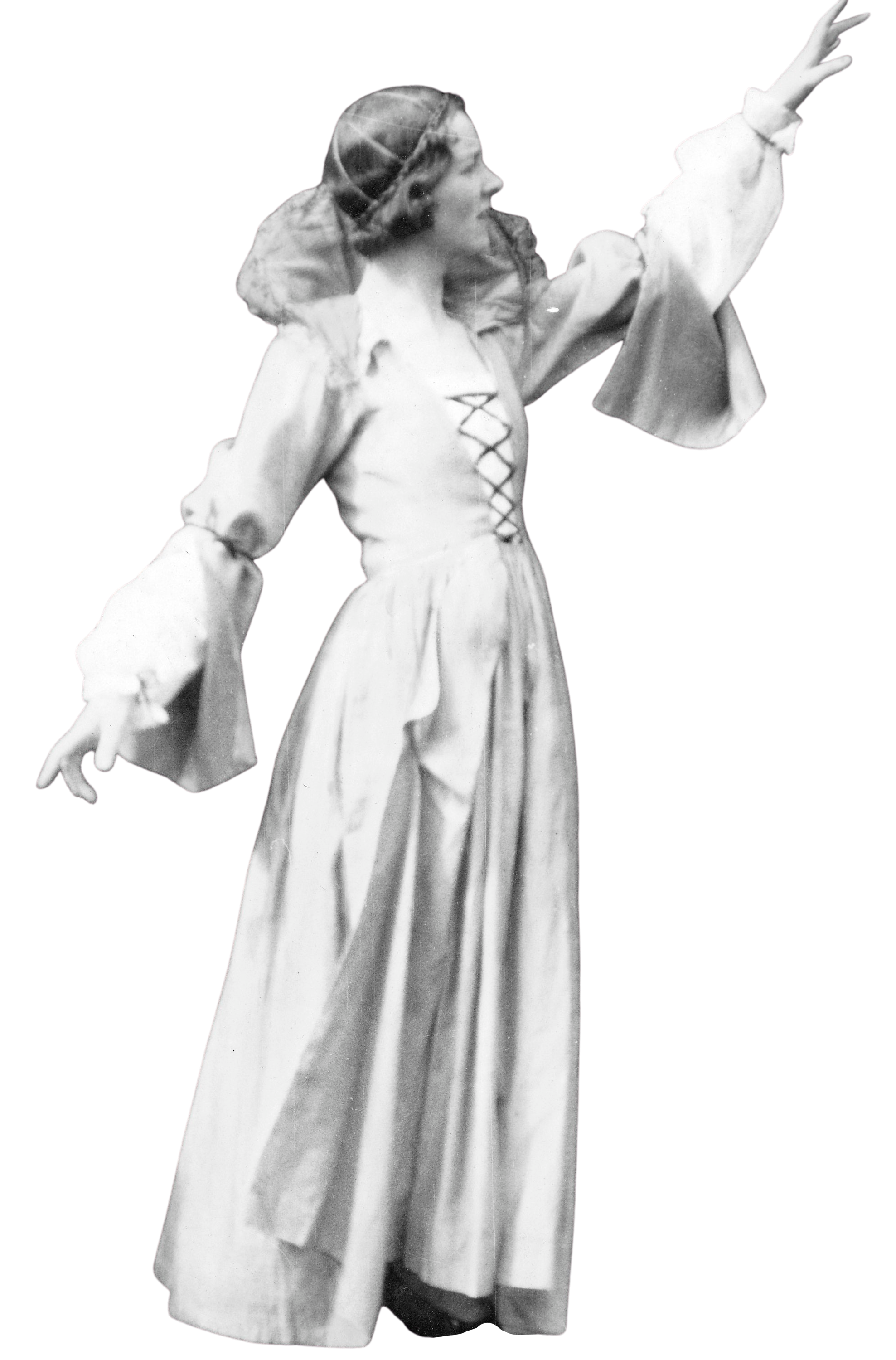 Black and white photo of a young woman wearing a long dress with a laced bodice, looking to her right with her right arm raised as if pointing or reaching upward.
