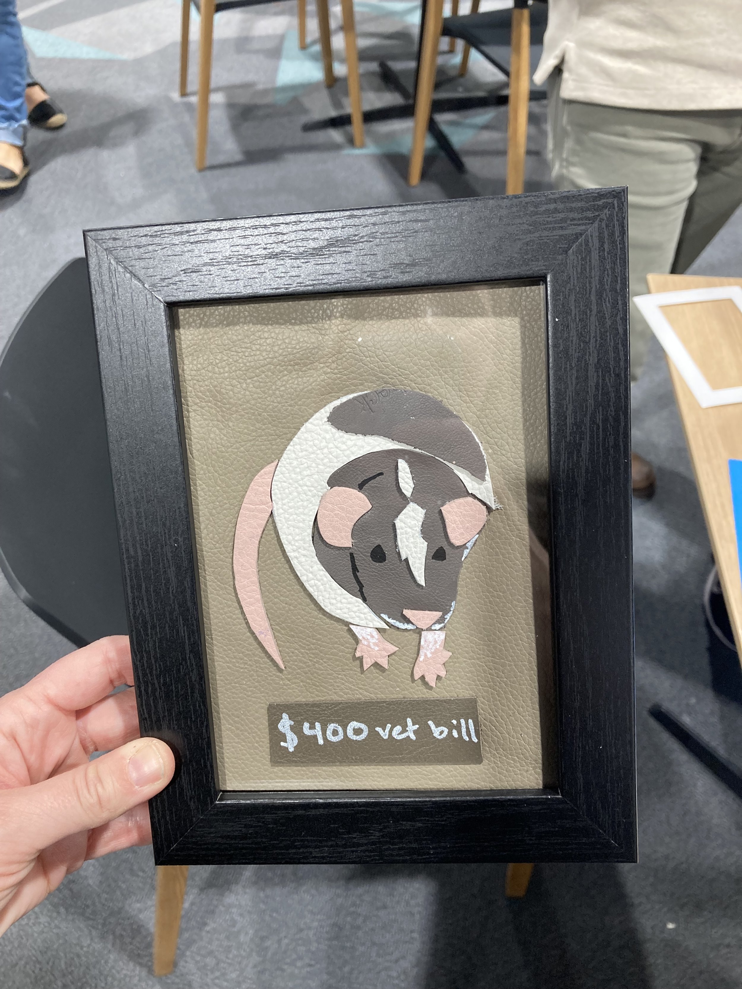 A leather craft project illustrating a pet mouse.
