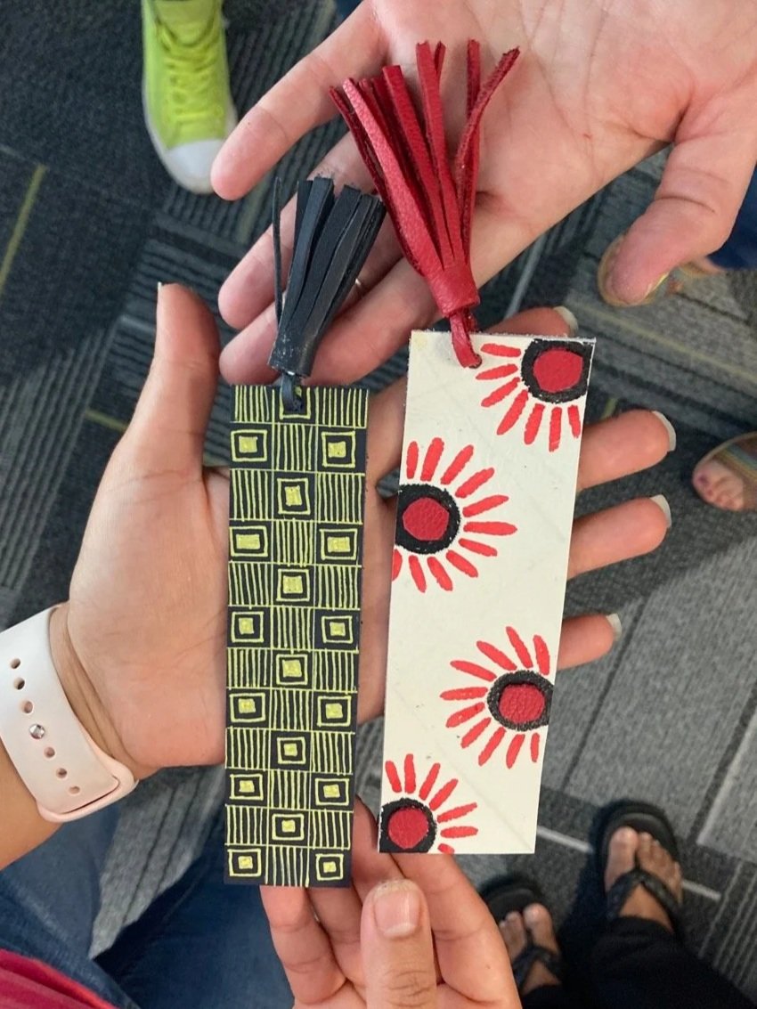 Leather bookmarks made from upcycled materials at a Kiki Knows Art workshop.