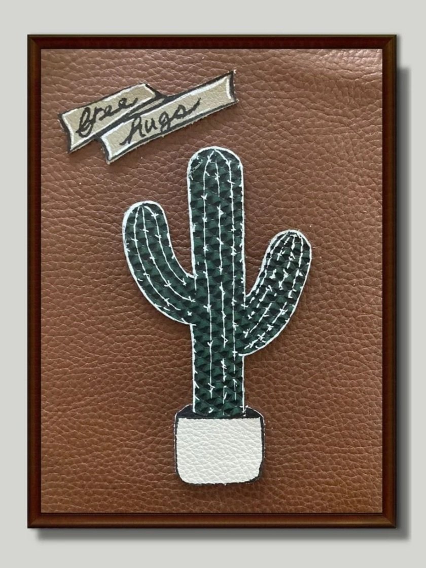 Frame leather art of a cactus made at a Kiki Knows Art workshop.