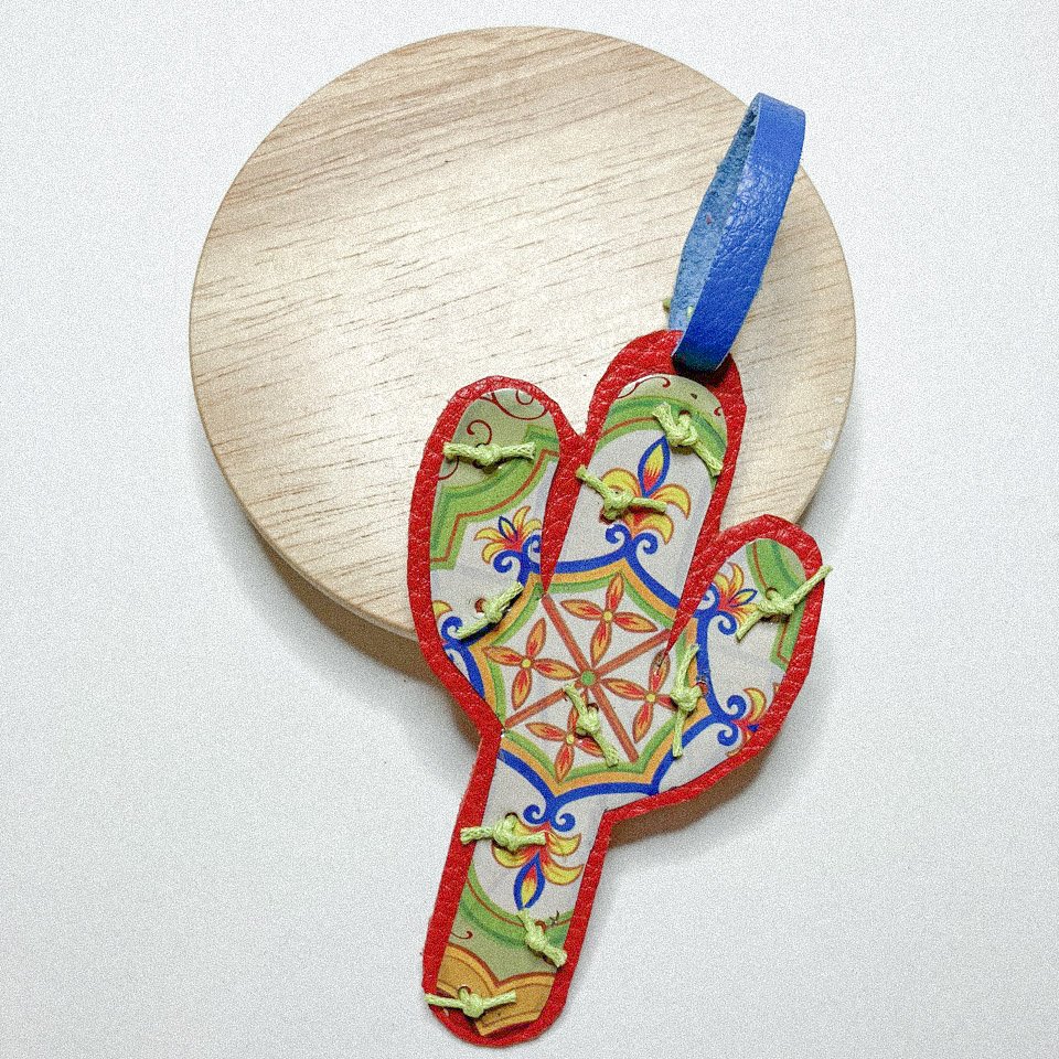 A colorful cactus ornament made from secondhand materials at a Kiki Knows Art Worksshop.