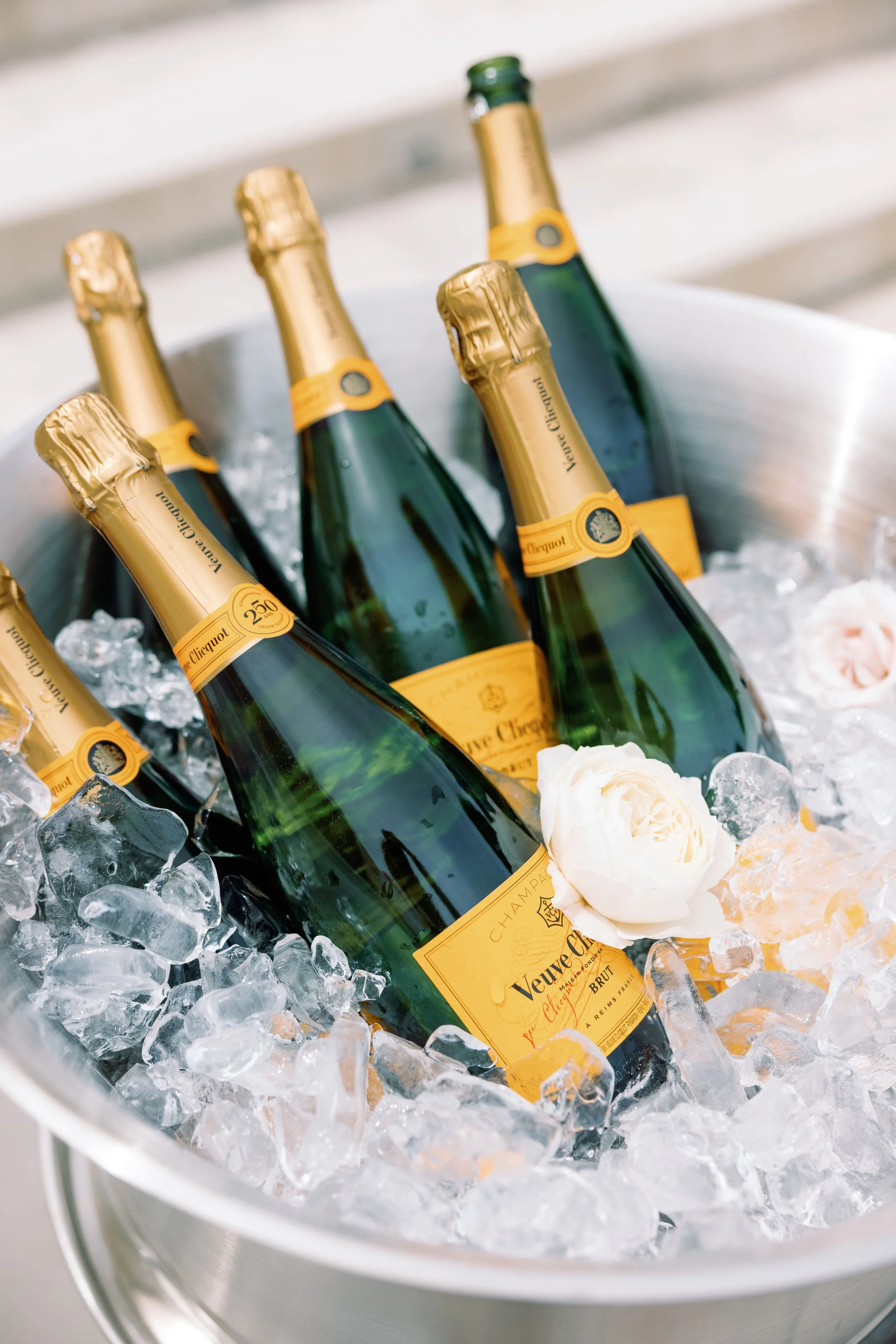 Chilled bottles of Veuve Clicquot champagne in ice bucket at a corporate or private event in Bay Area.