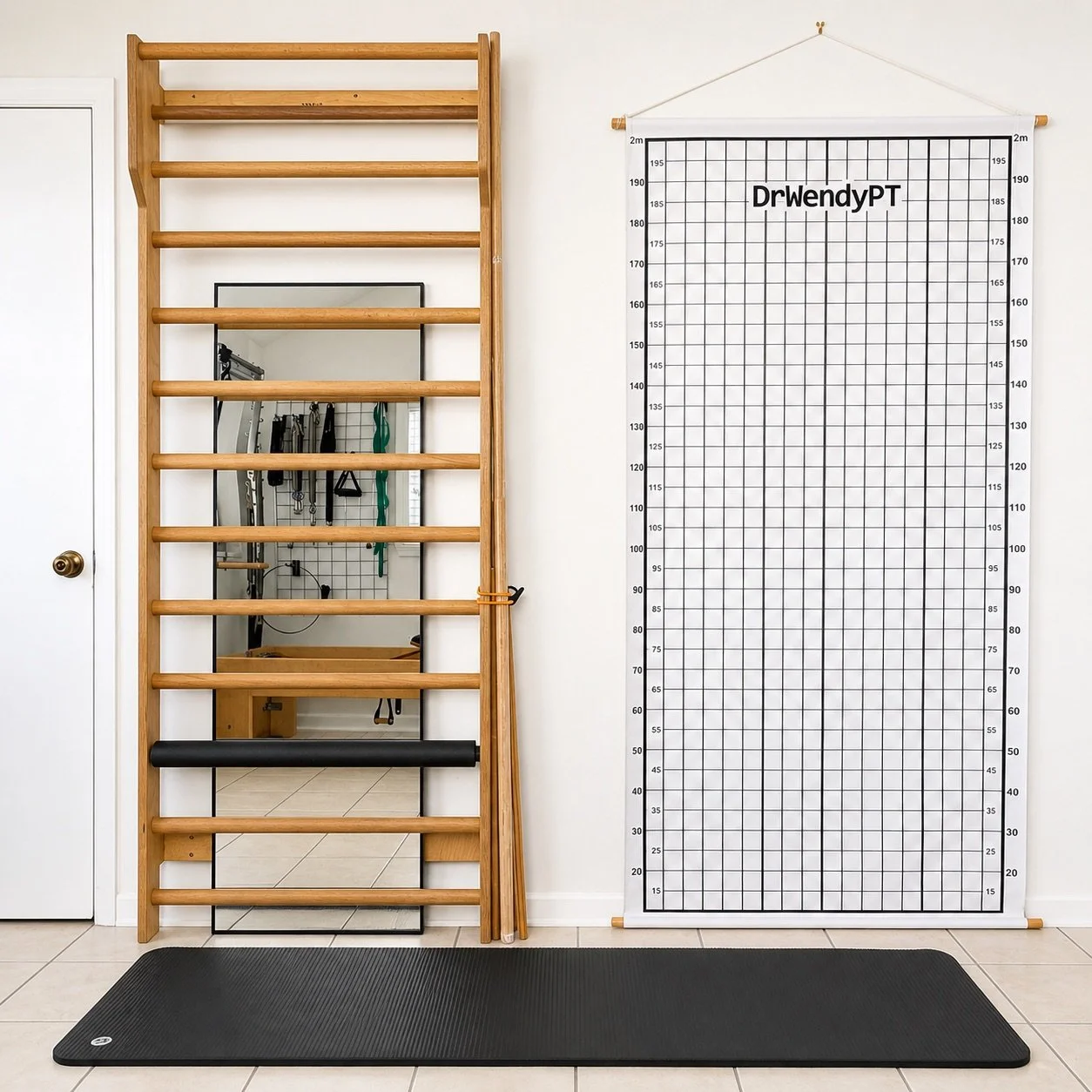 Home gym setup with a wooden wall-mounted exercise ladder, a black padded roller, a full-length mirror, and a Pilates reformer with resistance bands on the wall, next to a large fitness chart with the name 'DrWendyPT'.