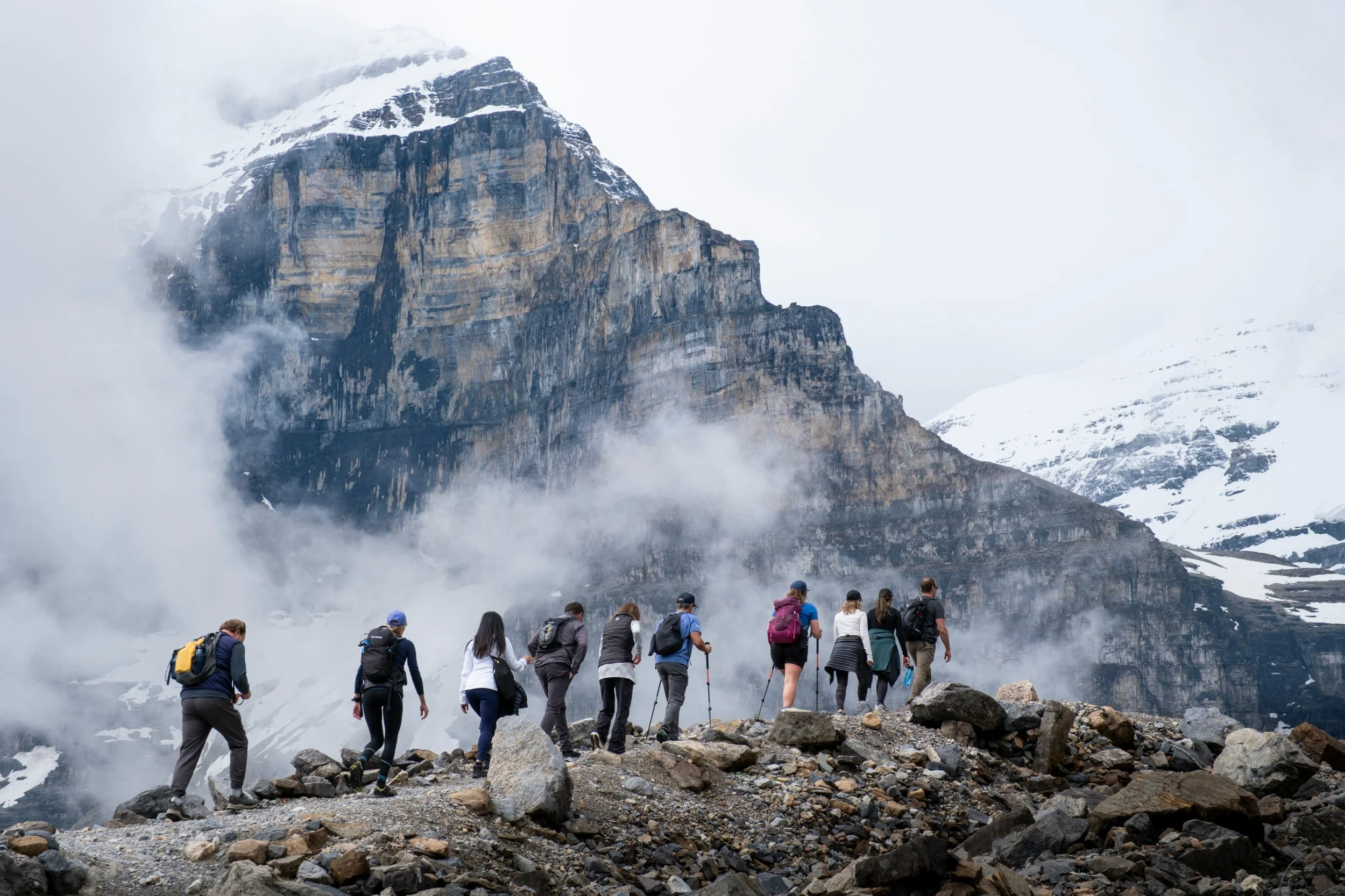 Group of hikers on a mountain trail, representing 'The ASCENT Series,' a collaborative coaching package focused on structured behavioral change and skill building.