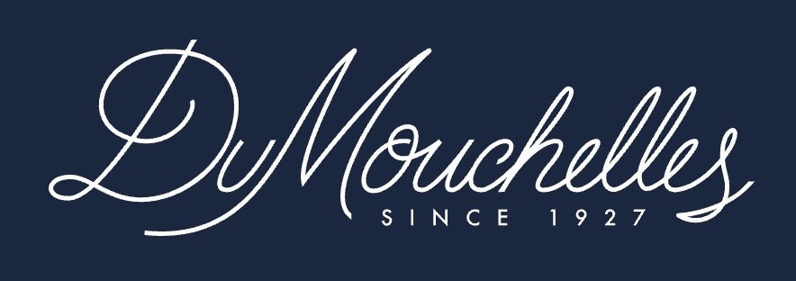 DuMouchelles logo with “Since 1927” in white script on a navy background