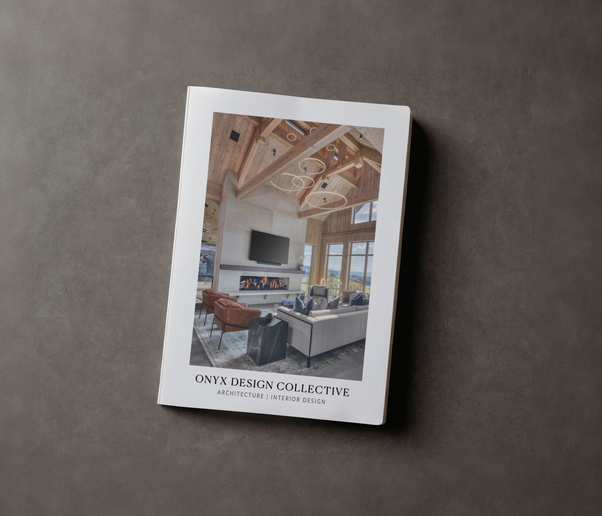 A brochure from ONYX Design Collective featuring a modern living room with wooden beams, a fireplace, and a wall-mounted TV.