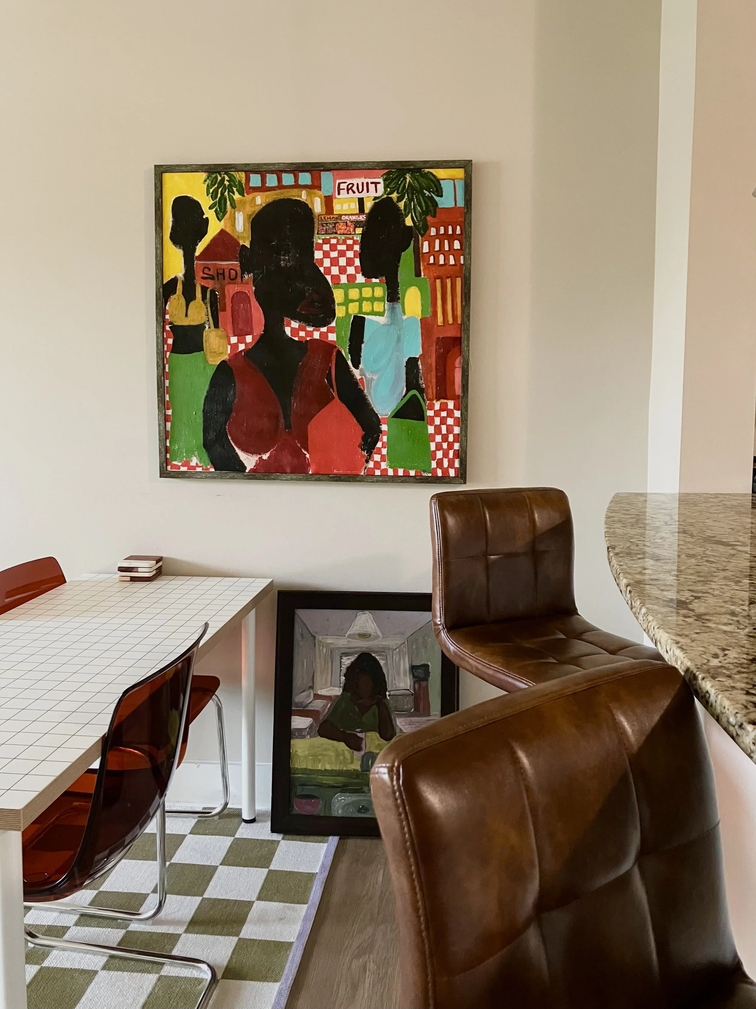 Fruit Market fine art print by Studio Nesha displayed in modern living room, colorful figurative wall art by New Orleans artist DeNesha Deans