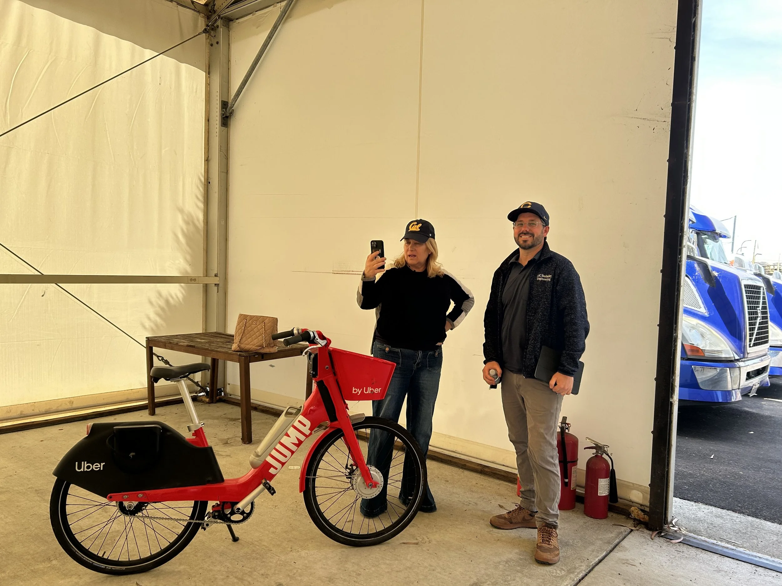 Seval Oz taking a phot of a red bike