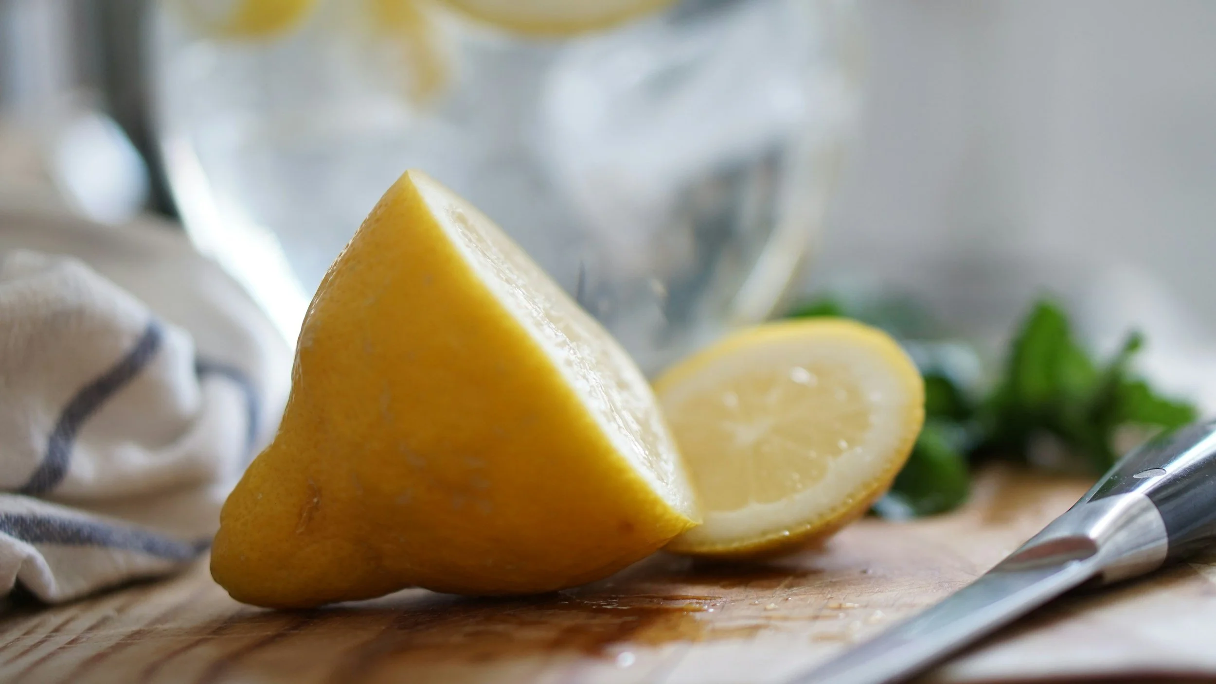 Fresh lemon cut on a kitchen cutting board