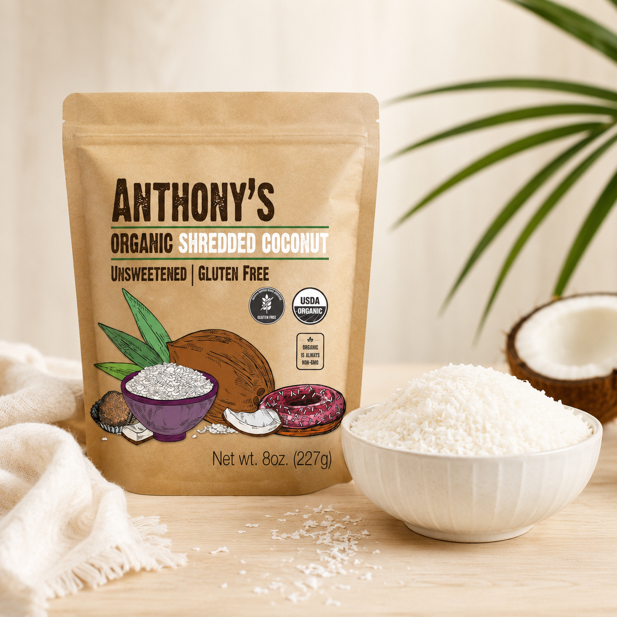 Organic unsweetened shredded coconut beside a bowl of coconut flakes.