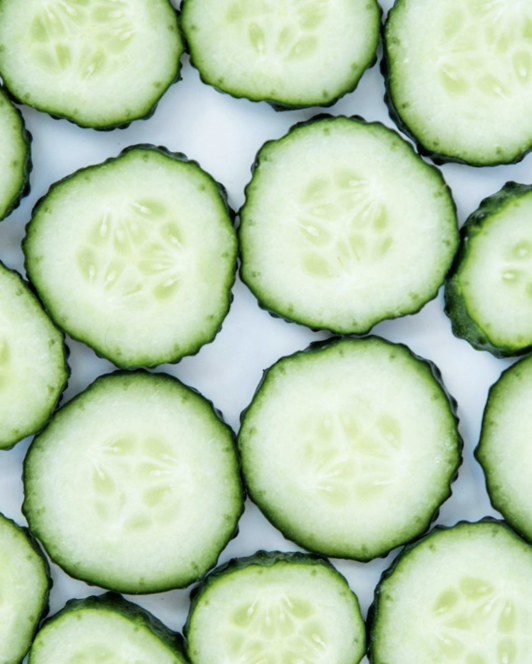 Fresh cucumber slices used in simple wellness drinks and recipes