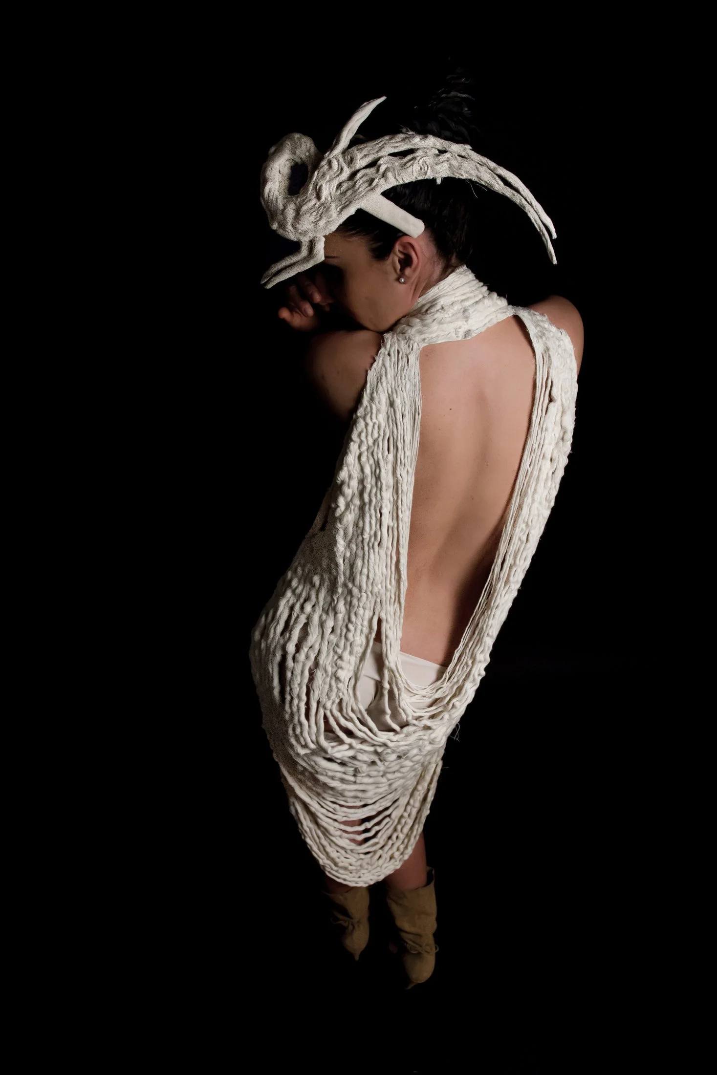 Back view of the Liberta collection highlighting sculptural garment construction by Zara Saberi.