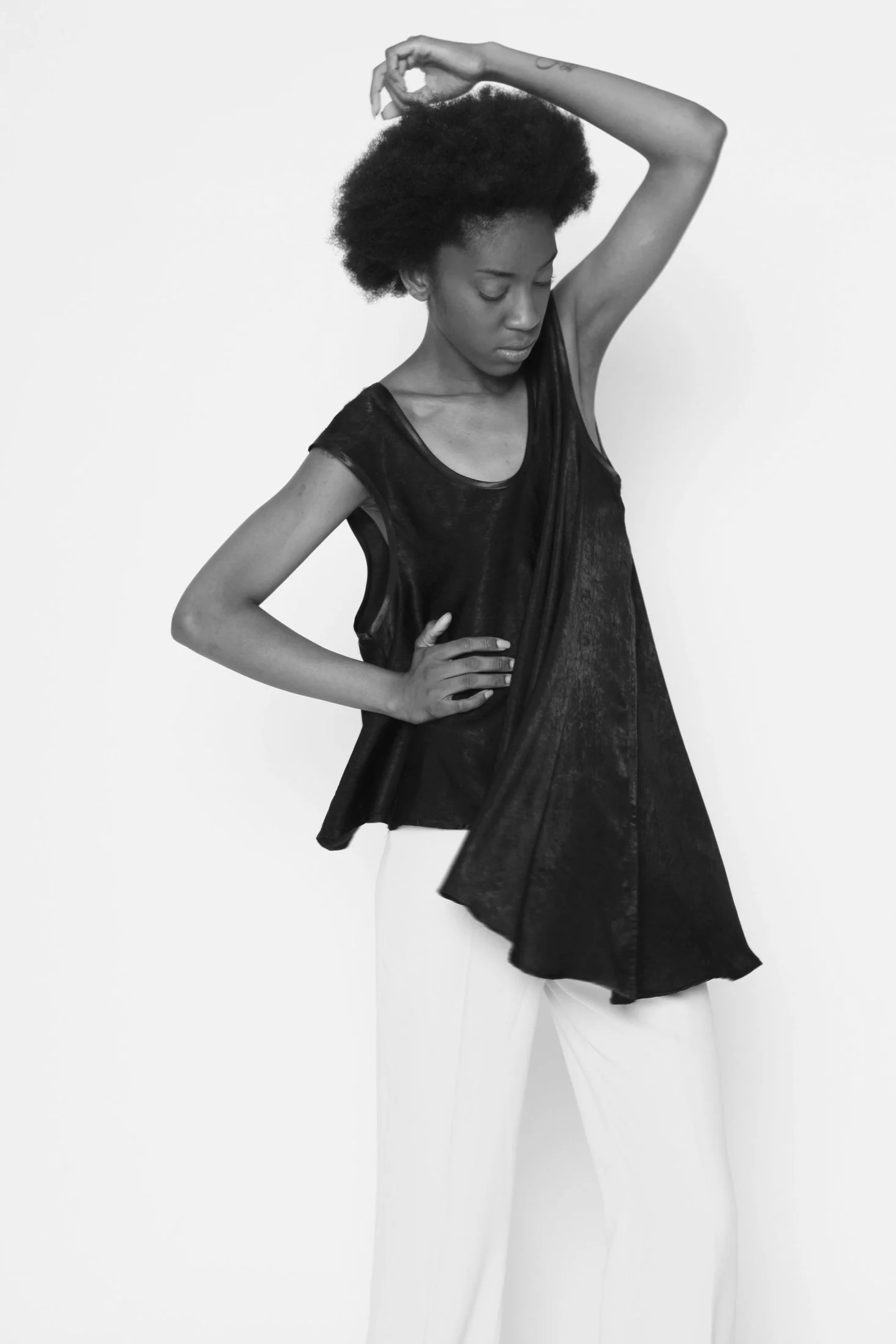 Zara Saberi — Black minimalist garment inspired by spatial composition.