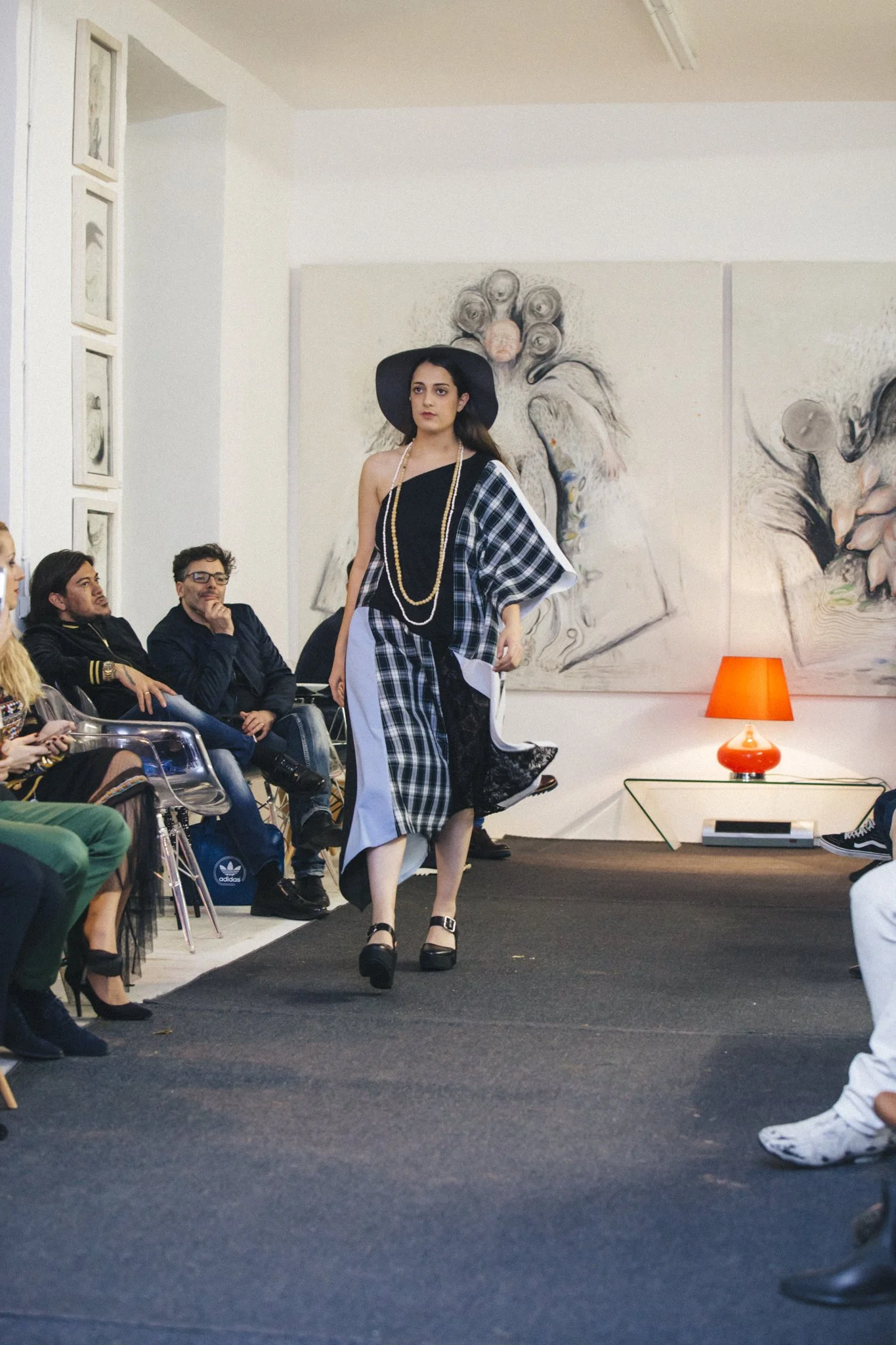 Zara Saberi — Structured silhouette from the Simple Line collection presented on the Madrid runway in 2016.