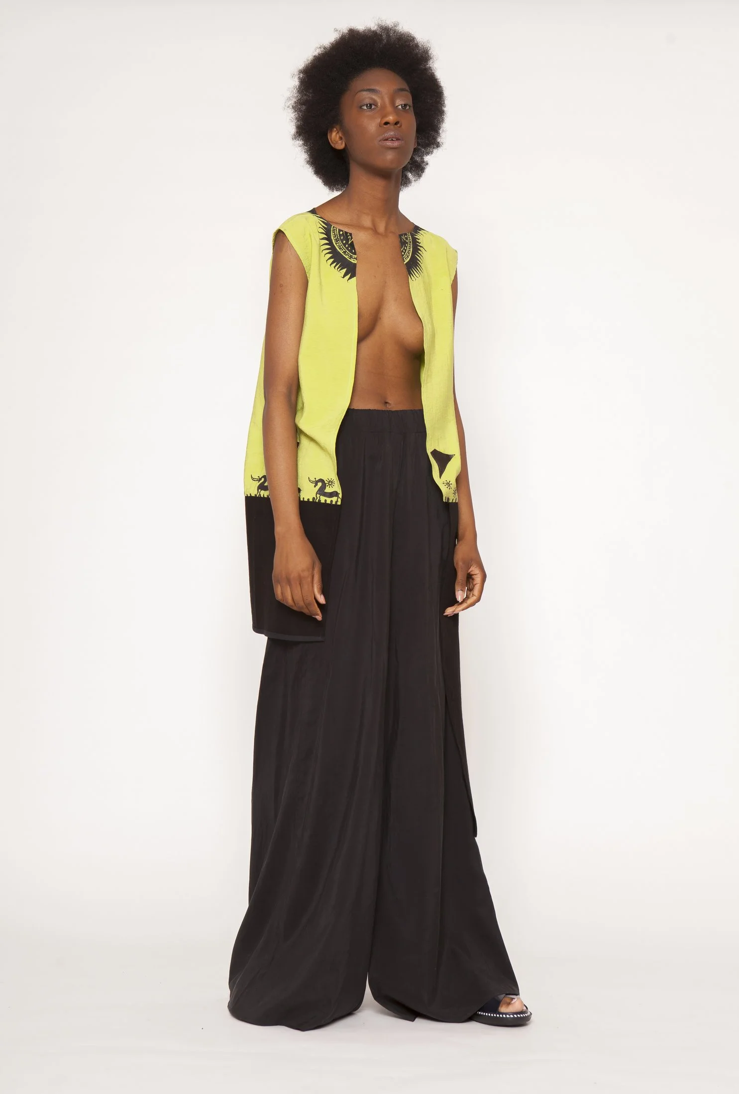 Zara Saberi — Handcrafted garment where painted marks and embroidery become one composition.