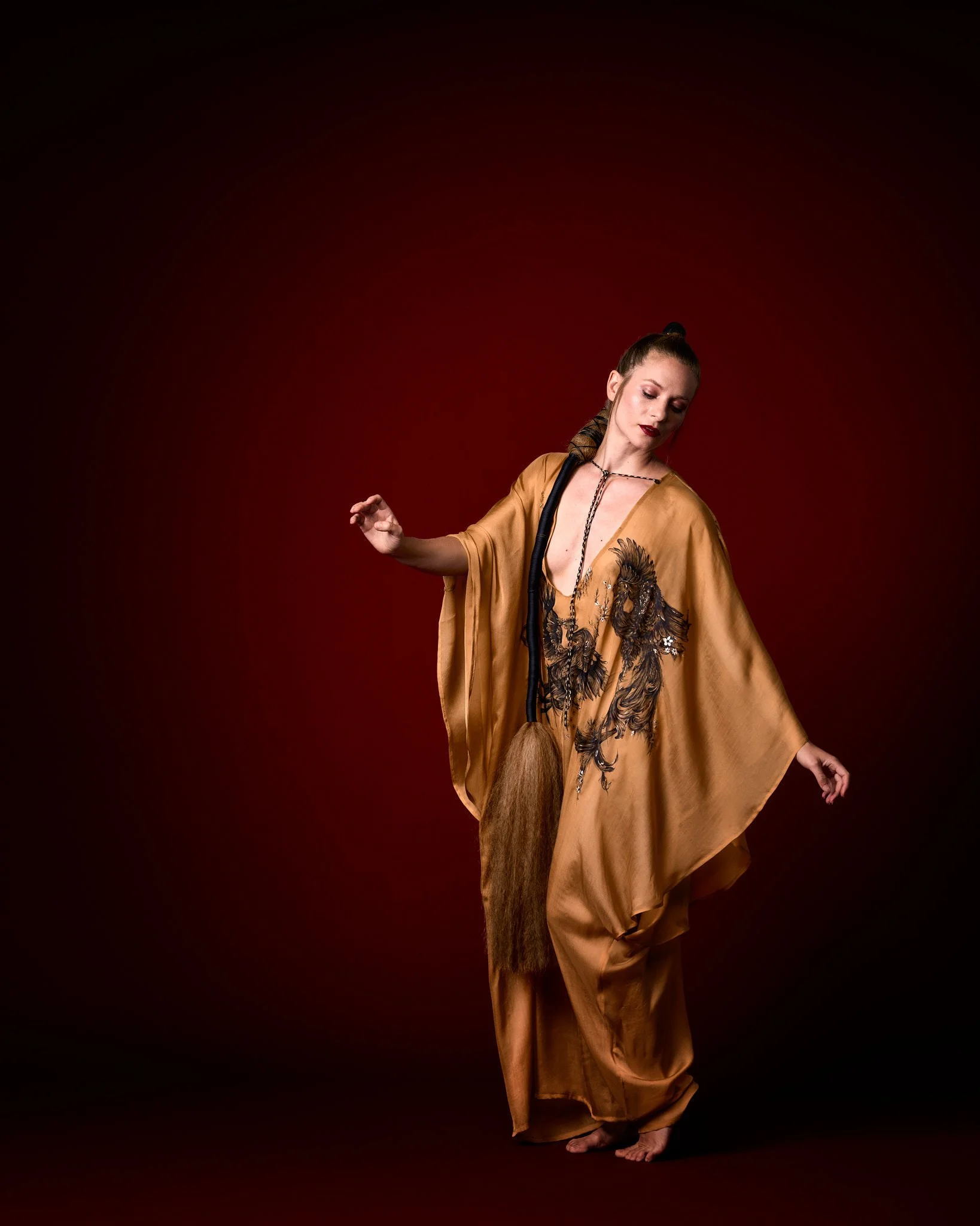 Zara Saberi — Hand-painted gold kaftan featuring Persian miniature artwork on Italian silk, photographed in Madrid, Spain.