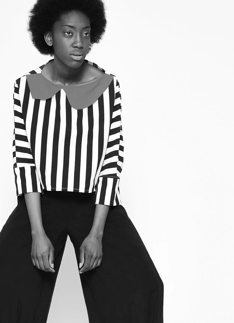 Zara Saberi — Black cotton silhouette inspired by architectural lines.
