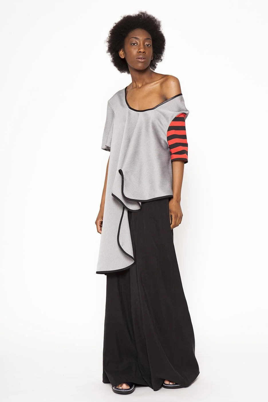 Zara Saberi — Architectural garment exploring rhythm through simple forms.