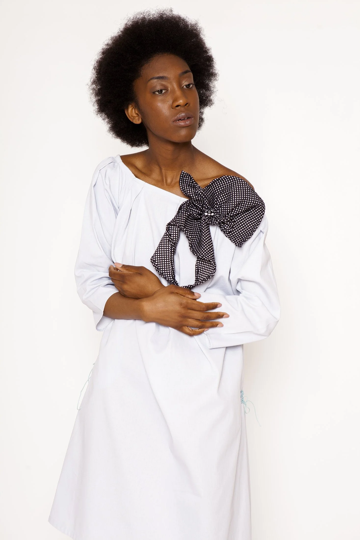 Zara Saberi — Embroidered garment where every stitch becomes part of the visual composition.