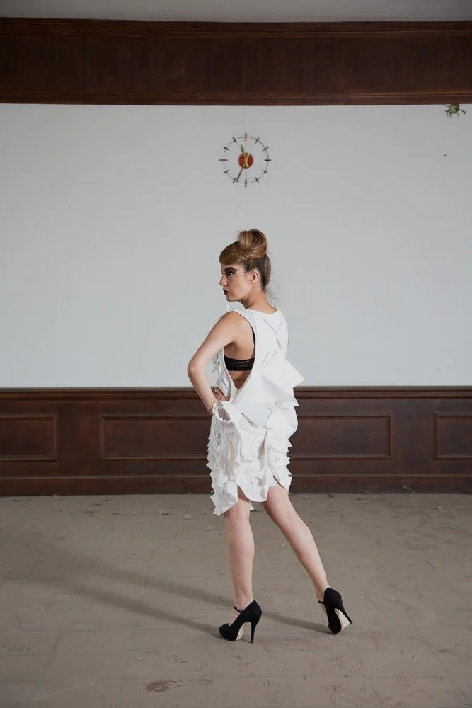 Zara Saberi — Experimental garment revealing visible construction, seams and geometric tension.