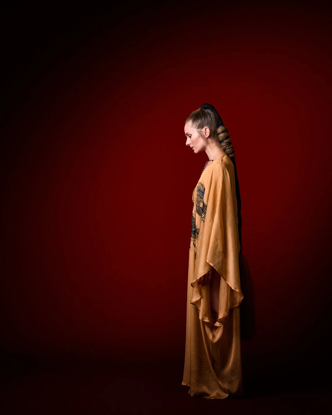 Zara Saberi — Couture gold kaftan combining Italian silk, chiffon and hand-painted Persian miniature art, photographed in Madrid, Spain.