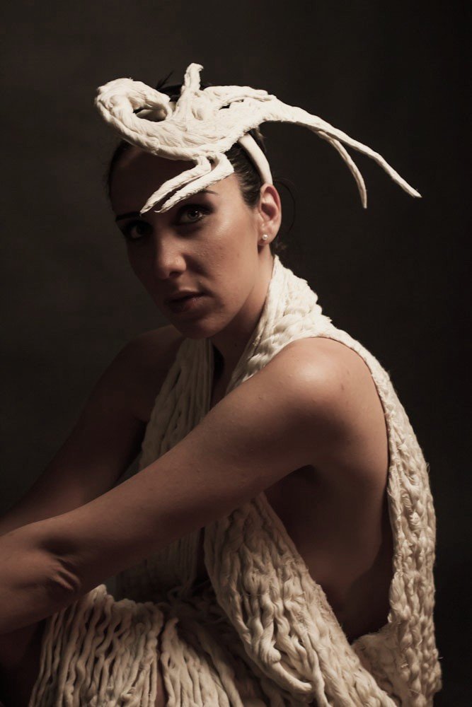 Model wearing the Liberta collection by Zara Saberi in an artistic fashion portrait.