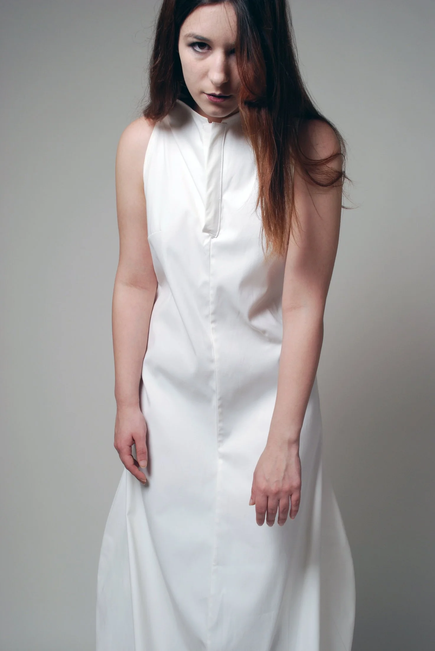 Zara Saberi — Minimal contemporary fashion from the Woman VS Woman collection expressing emotional tension.