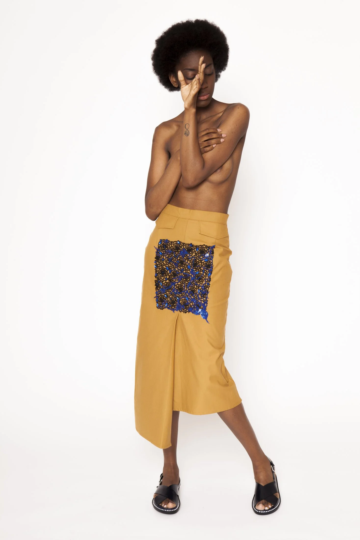 Zara Saberi — Handcrafted fashion piece featuring intricate embroidery and guipure lace.