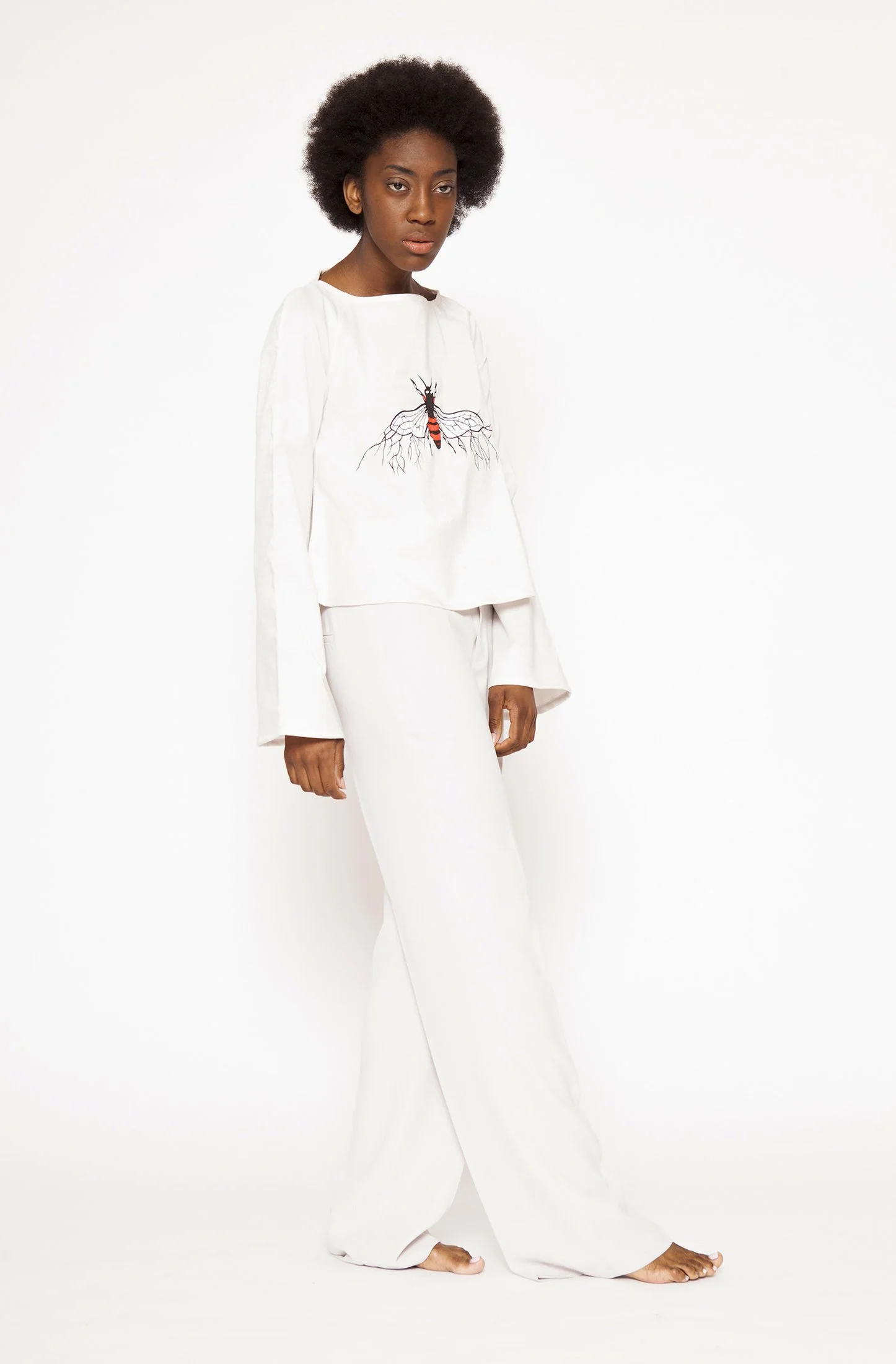 Zara Saberi — Garment featuring hand embroidery, appliqué and layered textile techniques.