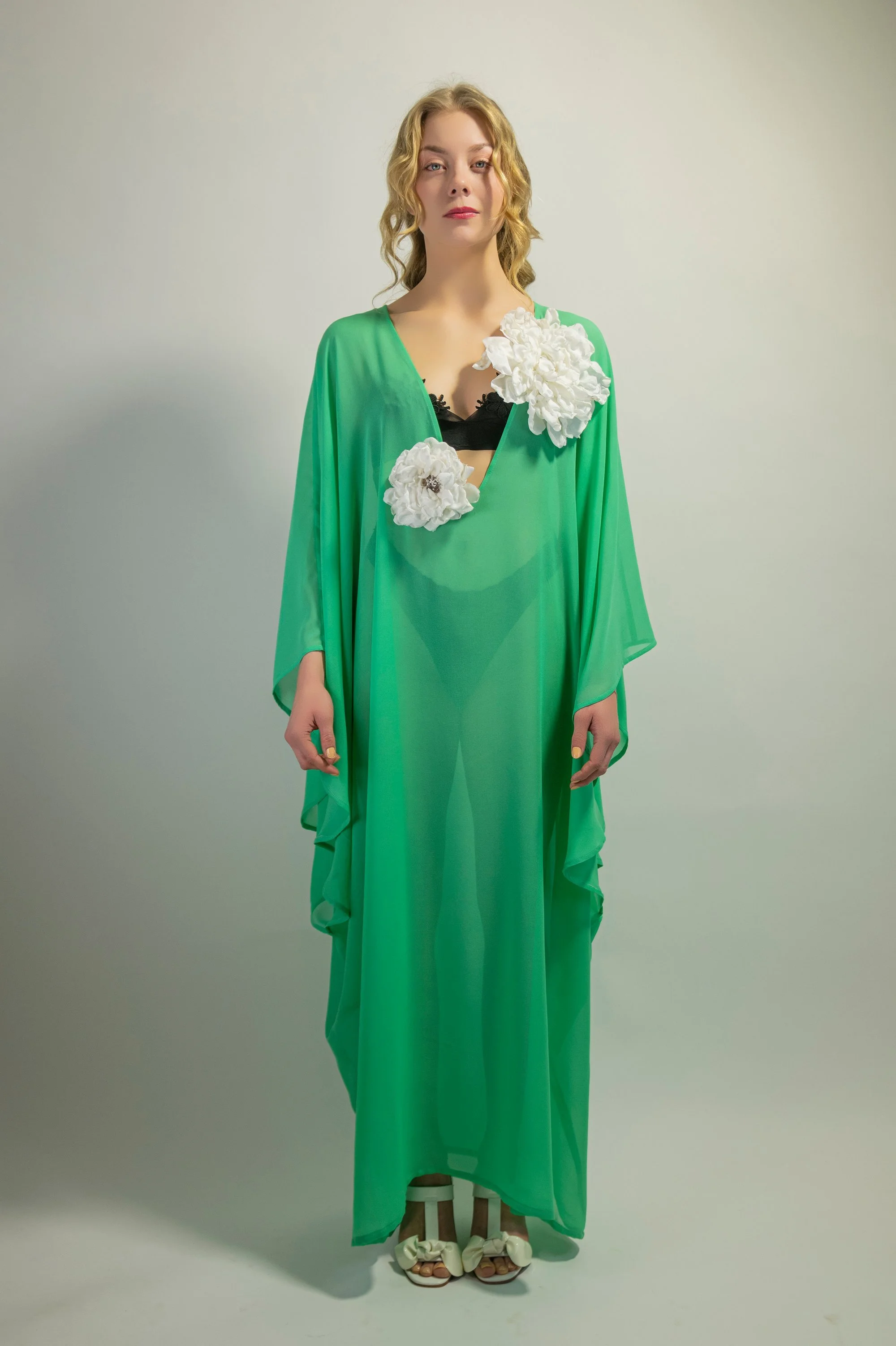 Zara Saberi — transparent aqua kaftan draping on body, close-up — Me and Transparency collection, Sweden