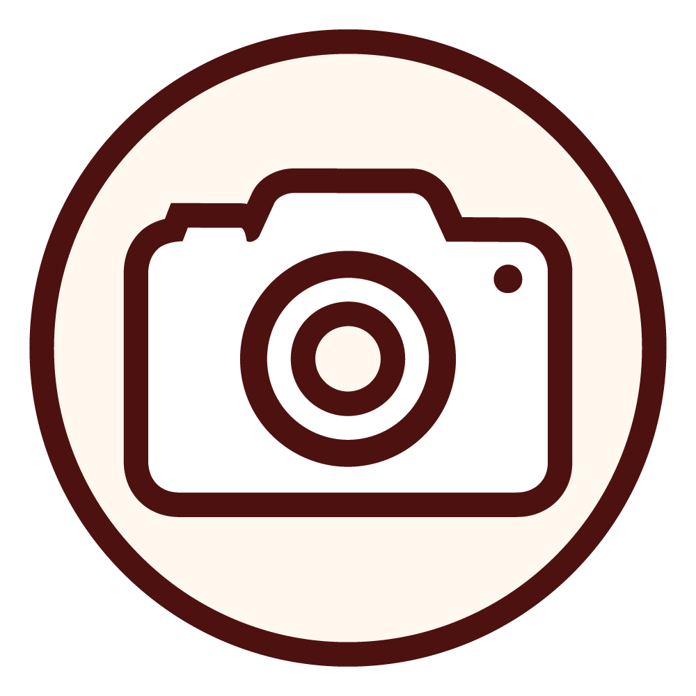 Icon of a camera inside a circular border.