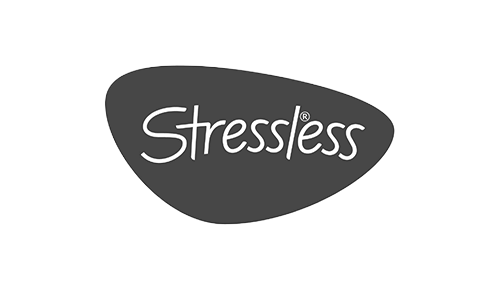 Logo with the word 'Stressless' inside an irregular dark gray shape.