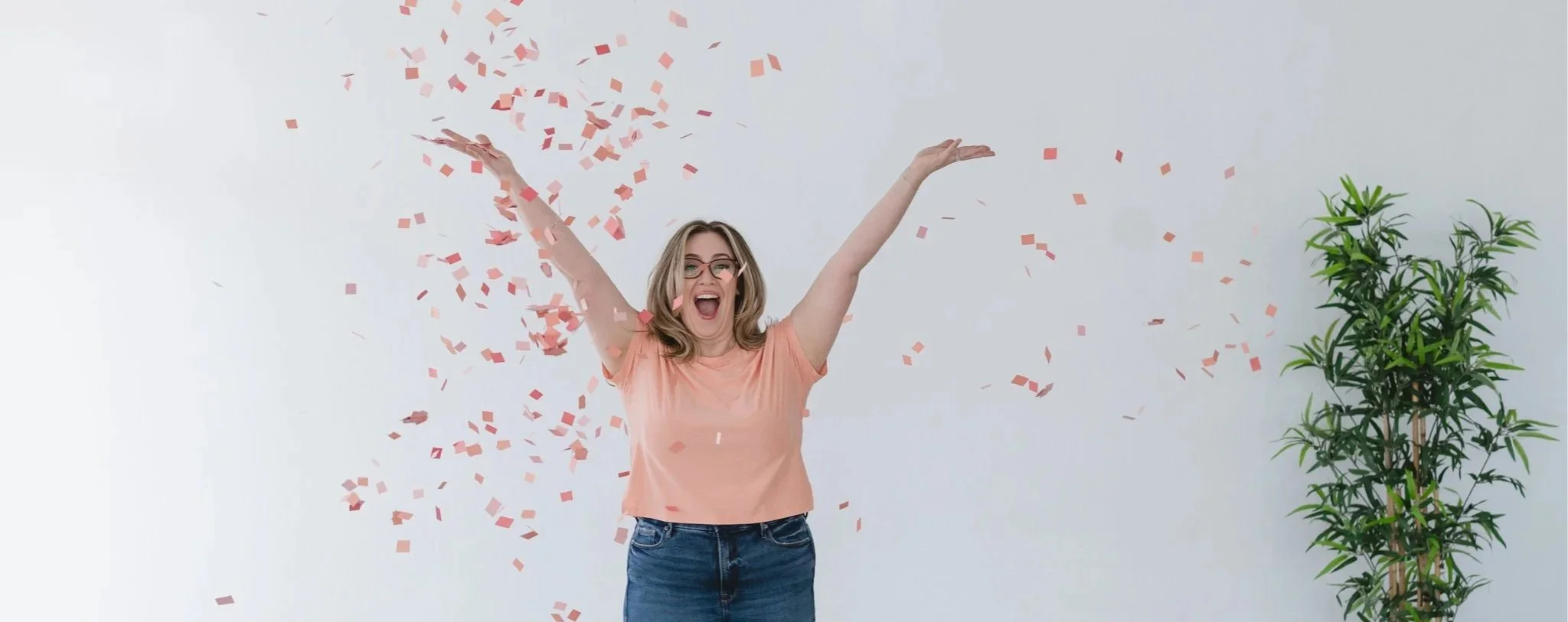 ADHD Mama Life found Kim celebrating, arms raised, confetti falling around her