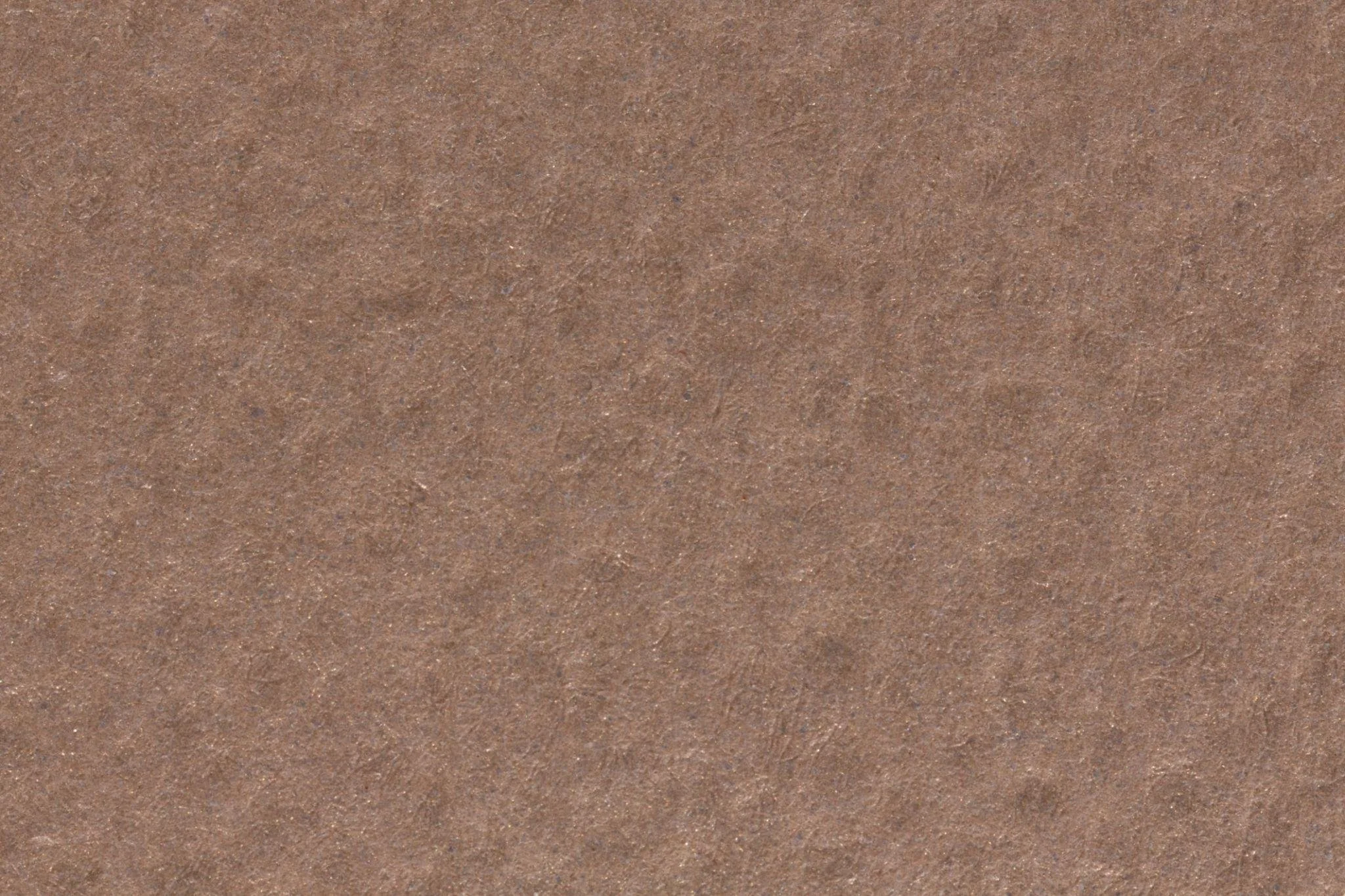 Close-up of brown textured paper or cardboard surface.