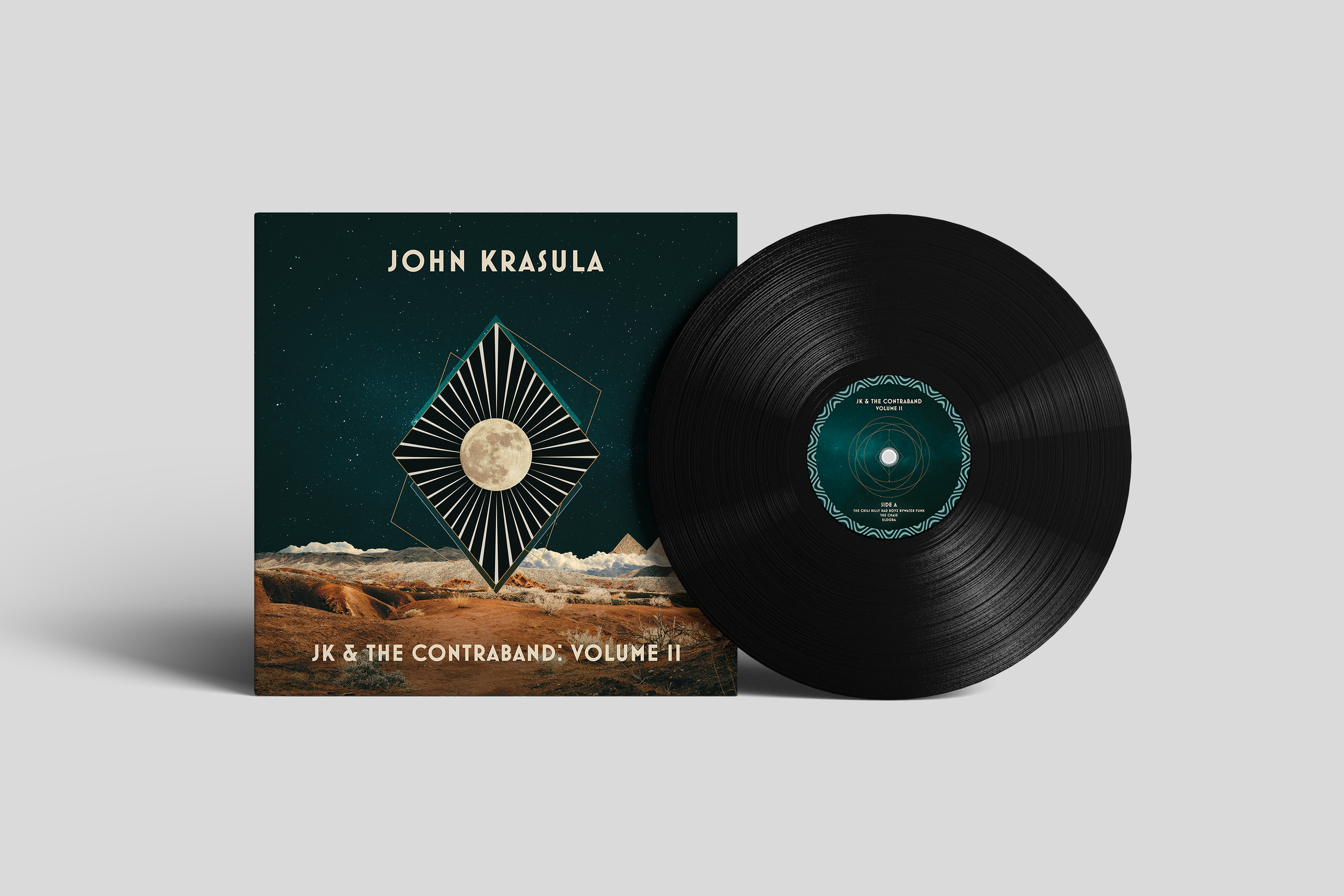 A vinyl record and album cover titled "JK & The Contraband: Volume II" with a desert landscape and a geometric moon design on the cover.