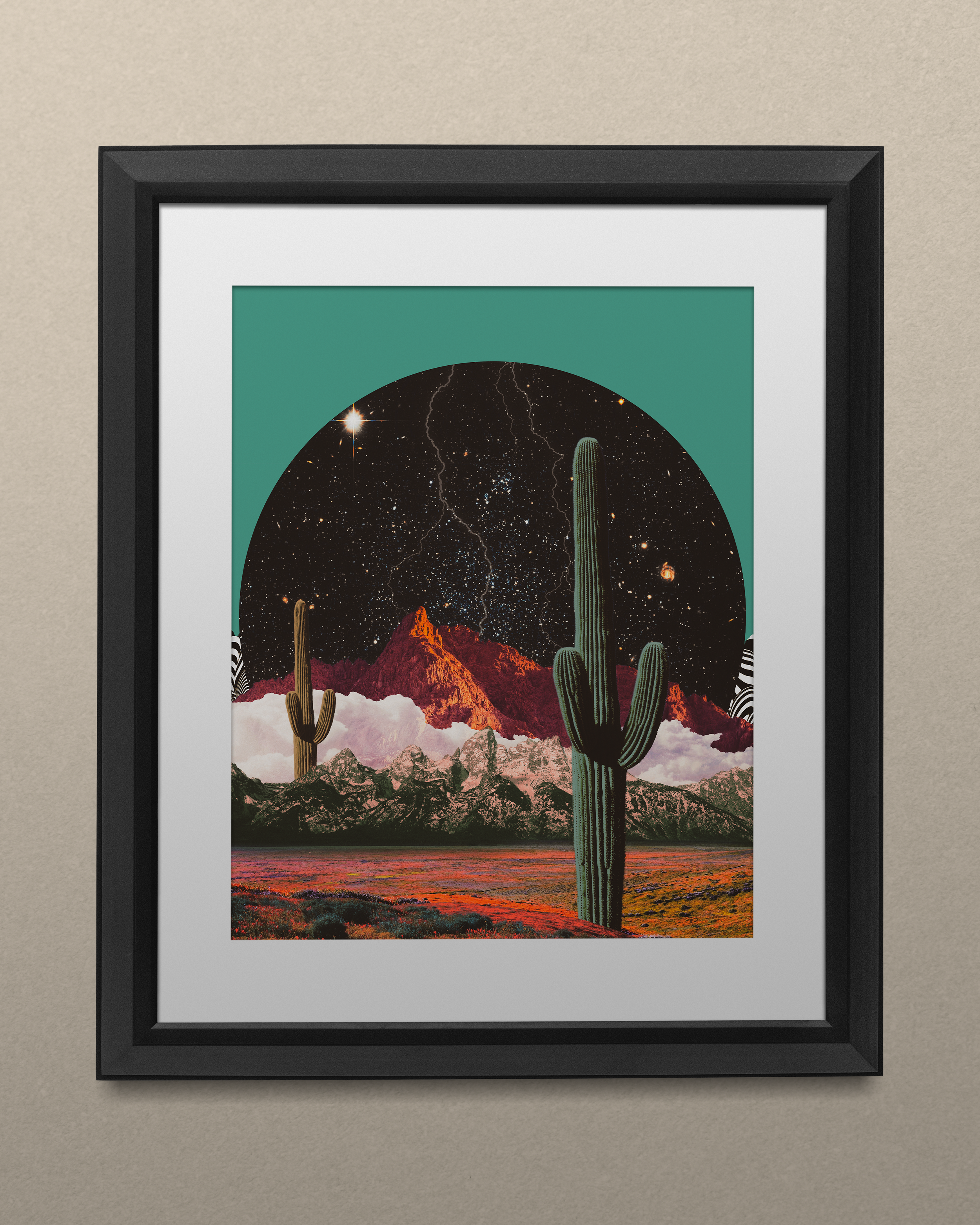 Framed artwork of a surreal desert landscape with a starry night sky, featuring cacti, mountains, and lightning bolts.
